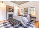 Main bedroom featuring natural lighting, a fireplace, hardwood floors, and crown molding at 21 1/2 Pitt St, Charleston, SC 29401