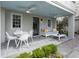 Inviting outdoor living with a covered porch, fan, modern furniture, and a stylish seating area at 21 1/2 Pitt St, Charleston, SC 29401