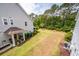 Expansive backyard featuring lush lawn and a backdrop of mature trees, perfect for outdoor activities at 2119 Oyster Reef Lane Ln, Mount Pleasant, SC 29466
