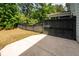 The backyard boasts a private patio area and a tall fence surrounded by lush trees for enhanced privacy at 2119 Oyster Reef Lane Ln, Mount Pleasant, SC 29466