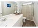 Bright bathroom featuring a modern vanity with sleek countertops and a shower with patterned curtain at 2119 Oyster Reef Lane Ln, Mount Pleasant, SC 29466