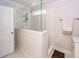 Clean shower featuring white tile and a glass enclosure in this bright and modern bathroom at 2119 Oyster Reef Lane Ln, Mount Pleasant, SC 29466