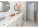 Bright bathroom vanity featuring double sinks, modern lighting, and elegant mirrors at 2119 Oyster Reef Lane Ln, Mount Pleasant, SC 29466