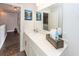 Well-lit bathroom vanity with white countertops, decorative accents, and a view into the hallway at 2119 Oyster Reef Lane Ln, Mount Pleasant, SC 29466