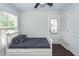 Bright bedroom featuring a ceiling fan, natural light, and wood floors at 2119 Oyster Reef Lane Ln, Mount Pleasant, SC 29466