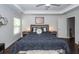 Charming bedroom with a decorative accent wall, tray ceiling, and a large, comfortable bed at 2119 Oyster Reef Lane Ln, Mount Pleasant, SC 29466