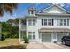 Charming two-story home with a covered porch, well maintained lawn, and an attached garage at 2119 Oyster Reef Lane Ln, Mount Pleasant, SC 29466