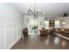Spacious living room with dark wood floors, modern light fixture, and sliding glass doors to outdoor patio at 2119 Oyster Reef Lane Ln, Mount Pleasant, SC 29466