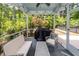 Inviting screened porch with outdoor seating, perfect for enjoying the surrounding natural landscape at 2119 Oyster Reef Lane Ln, Mount Pleasant, SC 29466