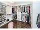 Organized walk-in closet with custom shelving, hanging racks and center storage in a spacious, well-lit area at 2119 Oyster Reef Lane Ln, Mount Pleasant, SC 29466