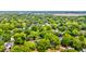 Aerial view of a neighborhood surrounded by lush greenery and mature trees at 2169 Westrivers Rd, Charleston, SC 29412