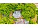 Aerial view of a home surrounded by lush green trees and landscaping at 2169 Westrivers Rd, Charleston, SC 29412