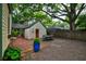 Backyard with brick patio, dining area, and lush landscaping at 2169 Westrivers Rd, Charleston, SC 29412
