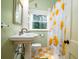 Bathroom featuring colorful floors, a shower with yellow flower curtain, and green walls at 2169 Westrivers Rd, Charleston, SC 29412