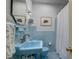 Blue vintage bathroom featuring original tile work and fixtures at 2169 Westrivers Rd, Charleston, SC 29412