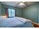 Comfortable bedroom featuring a queen-size bed, ceiling fan, and window at 2169 Westrivers Rd, Charleston, SC 29412