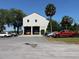 A view of the James Island Fire Station #1 building, featuring two bays, along with several parked vehicles and surrounding trees at 2169 Westrivers Rd, Charleston, SC 29412