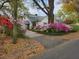 Charming home featuring a driveway lined with beautiful azaleas at 2169 Westrivers Rd, Charleston, SC 29412