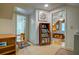 Hallway leading to the bathroom and bedroom with shelving and artwork at 2169 Westrivers Rd, Charleston, SC 29412