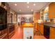 Modern kitchen with stainless steel appliances, custom cabinets, and a butcher block island, perfect for culinary enthusiasts at 2169 Westrivers Rd, Charleston, SC 29412