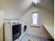 Bright laundry room with washer, dryer, and window at 2169 Westrivers Rd, Charleston, SC 29412