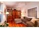 Living room with wood floors, ceiling fan, and built-in display cabinet at 2169 Westrivers Rd, Charleston, SC 29412