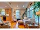 Bright living room featuring hardwood floors, a sofa, and access to the kitchen at 2169 Westrivers Rd, Charleston, SC 29412