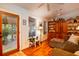 Living room with hardwood floors, natural light, and view of the porch at 2169 Westrivers Rd, Charleston, SC 29412