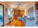 Living room with hardwood floors, built-in shelving, and comfortable seating at 2169 Westrivers Rd, Charleston, SC 29412