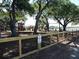 Inviting playground with modern equipment surrounded by lush green trees at 2169 Westrivers Rd, Charleston, SC 29412