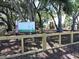 Inviting playground with modern equipment surrounded by lush green trees at 2169 Westrivers Rd, Charleston, SC 29412