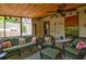 Cozy screened porch with wicker furniture, a ceiling fan, and a patterned rug at 2169 Westrivers Rd, Charleston, SC 29412