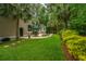 Lush backyard with patio, seating, lounge chairs, and charming outdoor space at 225 River Oak Dr, Mount Pleasant, SC 29464