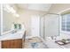 Bright bathroom featuring a double sink vanity, soaking tub and tiled floors at 225 River Oak Dr, Mount Pleasant, SC 29464