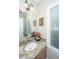 Bathroom with granite countertop, framed mirror, decorative floral accents, and natural light from a window at 225 River Oak Dr, Mount Pleasant, SC 29464