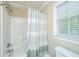 Bathroom showcasing a tiled shower/tub combo and a window for natural light at 225 River Oak Dr, Mount Pleasant, SC 29464