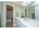 Bathroom with double sink vanity, white cabinets, and a view to the shower at 225 River Oak Dr, Mount Pleasant, SC 29464
