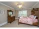 Bedroom showcasing a four-poster bed, window and traditional wood furniture at 225 River Oak Dr, Mount Pleasant, SC 29464