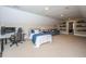 Spacious carpeted bedroom with sloped ceilings, a desk, and a comfortable sitting area at 225 River Oak Dr, Mount Pleasant, SC 29464
