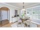 Cozy breakfast nook area filled with natural light with seating for four next to a storage buffet at 225 River Oak Dr, Mount Pleasant, SC 29464