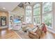 Bright living room with vaulted ceilings, large windows, and a built-in entertainment center at 225 River Oak Dr, Mount Pleasant, SC 29464