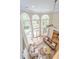 Bright, airy living room with soaring arched windows and an open design, showcasing the lovely outdoor views at 225 River Oak Dr, Mount Pleasant, SC 29464