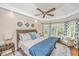 Spacious main bedroom with tray ceilings, a ceiling fan, and a bay window with great natural light at 225 River Oak Dr, Mount Pleasant, SC 29464