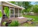 Inviting back porch with wood decking, potted plants, and view of the backyard at 2436 Stingray Blvd, North Charleston, SC 29406