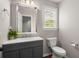 Bathroom boasts a modern vanity, large mirror, and ample natural light from a window at 2436 Stingray Blvd, North Charleston, SC 29406