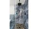 Luxurious shower featuring pebble floor and marble-look tile at 2436 Stingray Blvd, North Charleston, SC 29406