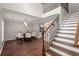 Well-lit dining room with chandelier, hardwood floors, and staircase that adds architectural interest to the space at 2436 Stingray Blvd, North Charleston, SC 29406