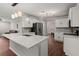 Kitchen with white cabinets, stainless steel appliances, and a view into the dining area at 2436 Stingray Blvd, North Charleston, SC 29406