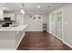 Kitchen includes island, stainless appliances and hardwood floors, and slider to patio at 2436 Stingray Blvd, North Charleston, SC 29406