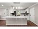 Kitchen features a breakfast bar, white cabinetry, and stainless steel appliances at 2436 Stingray Blvd, North Charleston, SC 29406